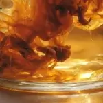 How to brew kombucha at home with SCOBY in a glass jar during fermentation.