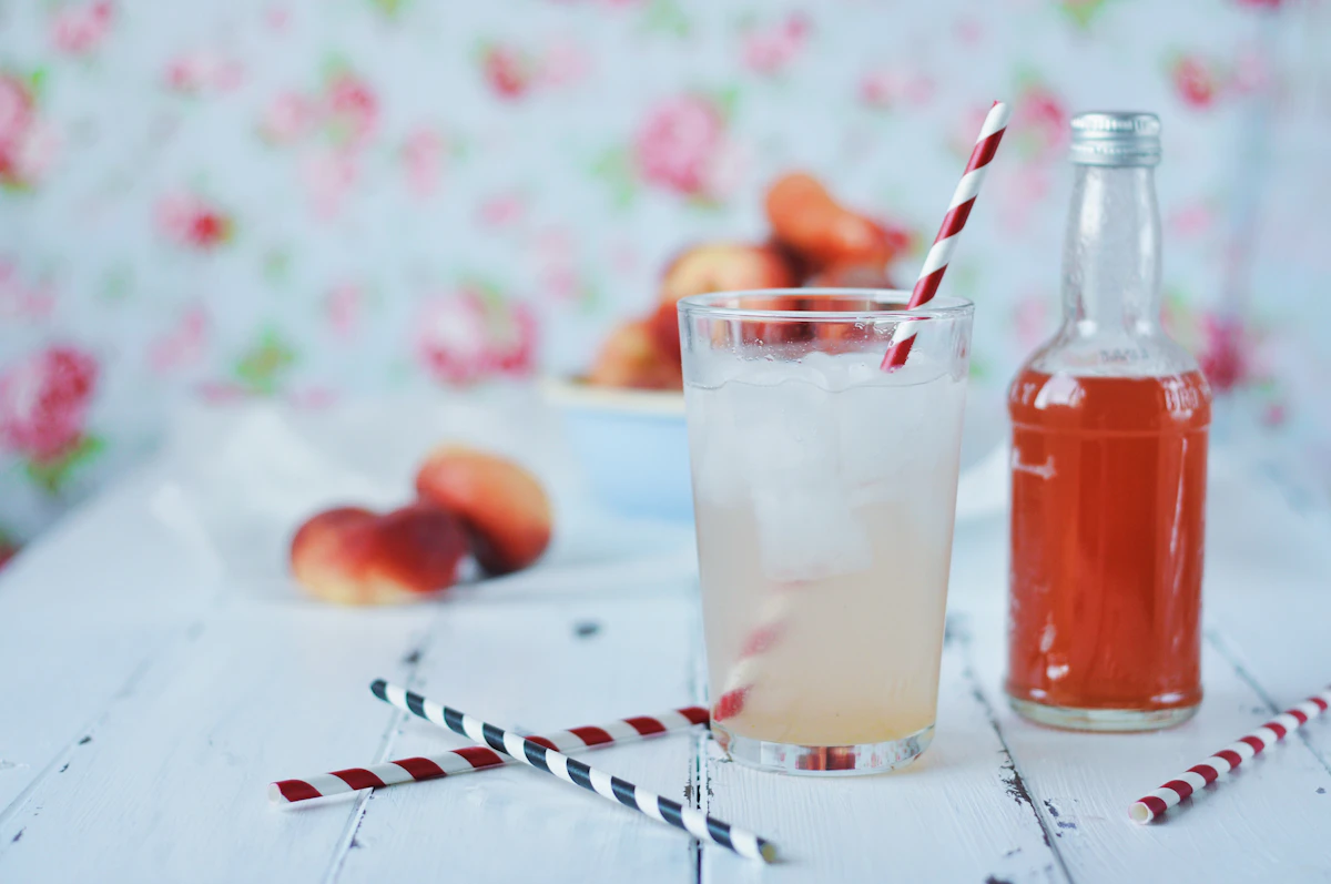 Glass of cold amber-colored drink, serving inspiration